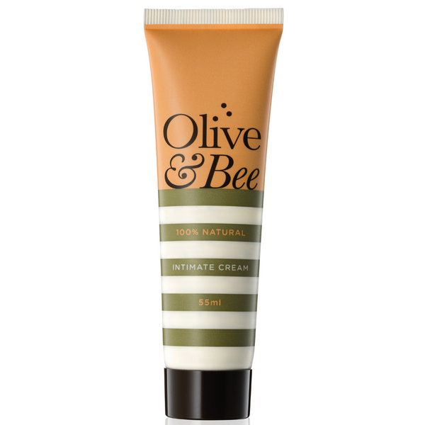 A vertical tube of YESยฎ Olive & Bee Intimate Cream with a beige and green label, stating "100% Natural" and "55ml" in white text. The cap is dark brown, and the overall design is clean and minimalist. This chemical-free moisturizer is perfect for sensitive skin hydration.