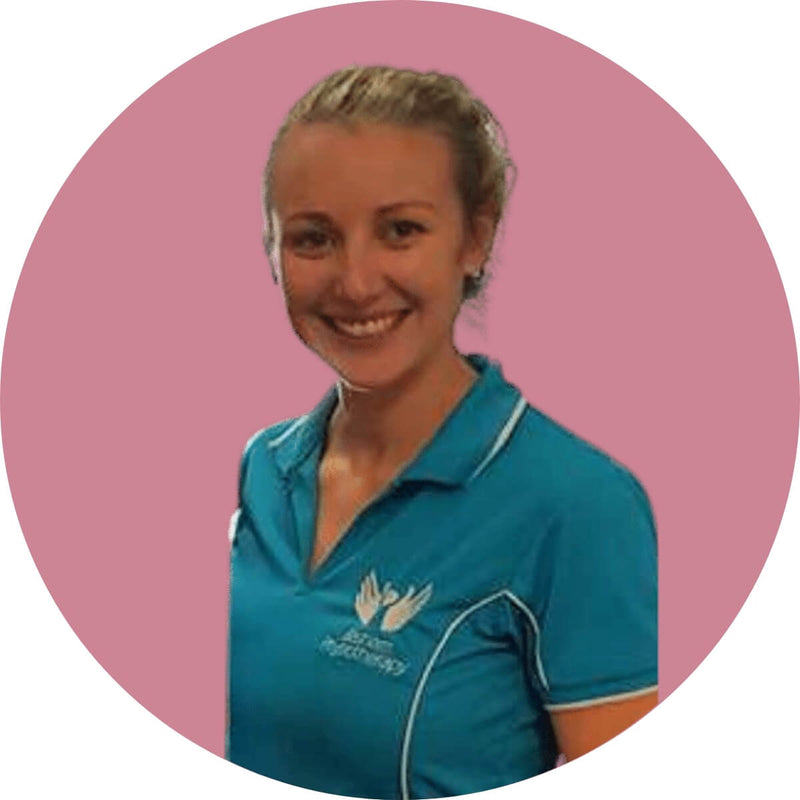 A smiling person with blonde hair pulled back, wearing a turquoise polo shirt with a white logo on the chest, stands against a solid pink circular background.