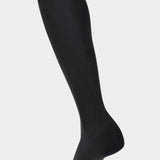 Black knee high compression stockings for improved blood circulation and reduced leg fatigue, ideal for use during pregnancy and post partum, for athletes, travelers, and individuals with varicose veins.