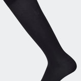 Black compression socks for improved blood circulation and reduced leg fatigue, ideal for use during pregnancy and post partum, for athletes, travelers, and individuals with varicose veins.