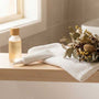 Intimate skincare products on a bedside table — postpartum lubricant guide from Blossom Pelvic Health