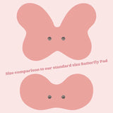 Replacement pad range for the Tap 2.0 wearable device – four pad shapes in blush pink and midnight black, including XL Butterfly Back, Butterfly, Electrode, and Discreet