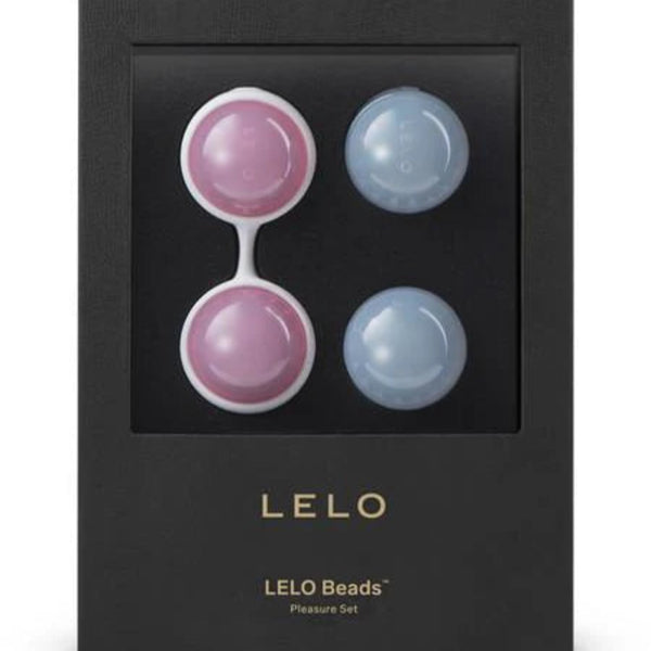 The LELO Luna Beads Classic by LELO includes four round beads—two pink, two blue—and a white silicone holder in sleek black packaging, perfect as a Kegel exercise aid and for enhancing pelvic floor strength.