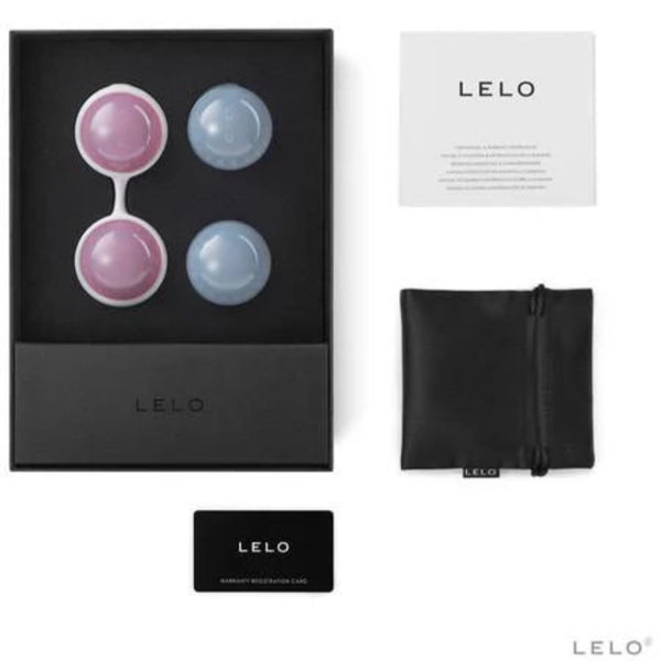 The LELO Luna Beads Classic by LELO includes two pink and two blue round Kegel exercisers, a white holder, instruction booklet, black pouch, and registration card—ideal for pelvic floor strength. All items are displayed on a white background.