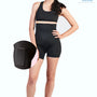 Woman wearing black SRC C-Section Recovery Mini compression shorts, front view