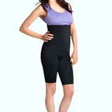 Woman wearing black SRC Rehab high-waist compression shorts, front view
