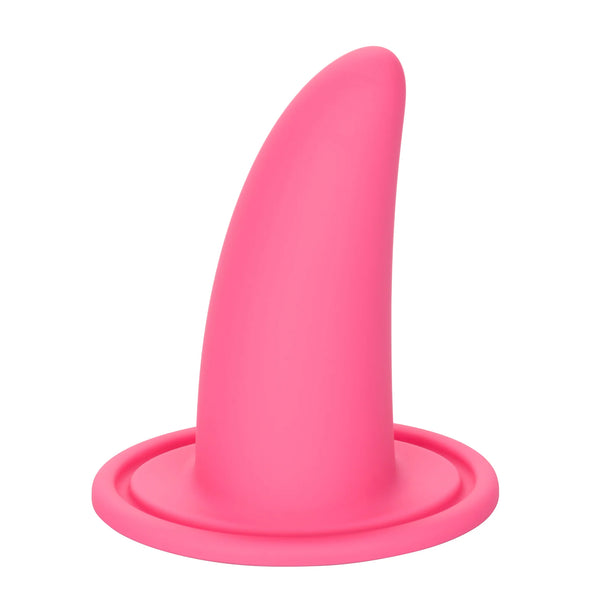 The She-ology™ 3-piece Wearable Vaginal Dilator Set by Calexotics features a pink, smooth, and slightly curved silicone plug that stands upright on a flat circular base. Made from body-safe silicone, it maintains a sleek and simple appearance. Designed without intricate details, this dilator set offers optimal comfort during vaginal dilation.