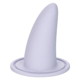 The She-ology™ 3-piece Wearable Vaginal Dilator Set by Calexotics features a smooth, conical white dilator rising from a circular base. The sleek design, made from body-safe silicone with a soft matte finish, resembles a fin or horn and is ideal for use as part of the wearable set.