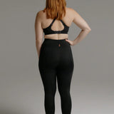 Back view of black SRC Restore full-length compression leggings