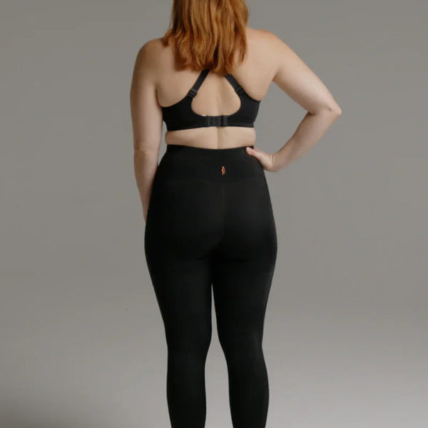 Back view of black SRC Restore full-length compression leggings