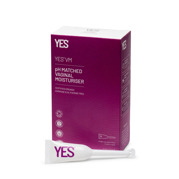 A box labeled "YES® VM Vaginal Moisturiser Applicators 5mL x6" from YES® is shown with a single-use applicator. The purple and white packaging highlights this natural, pH-balanced vaginal moisturiser with certified organic ingredients.