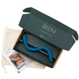 A blue wavy object, identified as The Bien Wave - Pelvic Floor Wand by BIEN Australia, inside an open black cardboard box with the text 