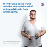 A person wearing a white T-shirt is holding the Intimate Rose Vibrating Pelvic Wand in blue.