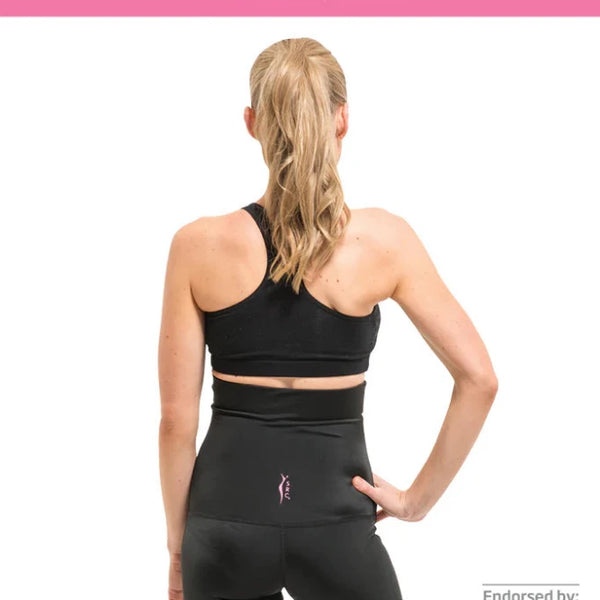 A woman with long blonde hair, wearing a black sports bra and high-waisted black shorts, is seen from the back. Text above reads: "SRC Health's C-Section Recovery Shorts: NEW softer and narrower top band, NEW phone pockets." Designed for optimal postpartum recovery with targeted compression. Endorsed by the Australian Physiotherapy Association.