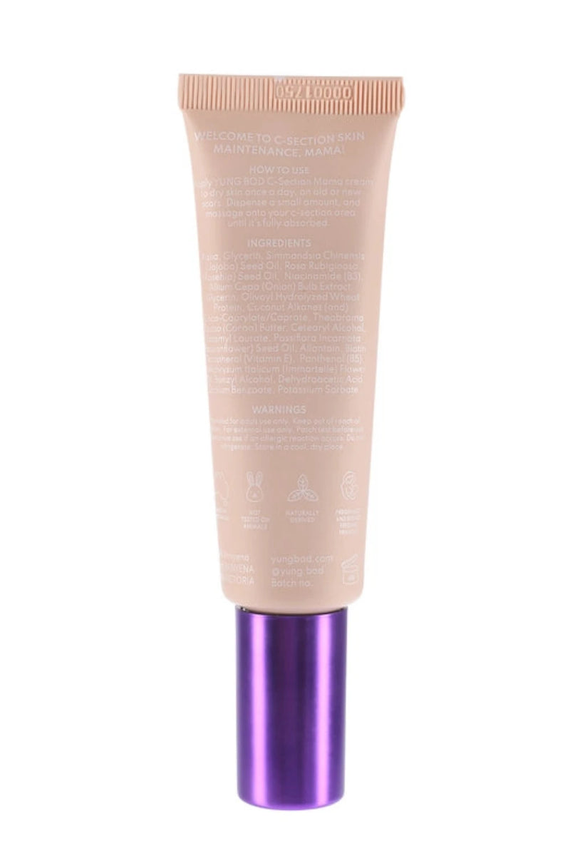 An image of the C-Section Mama Cream by Yung Bod, featuring a beige cosmetic tube with a purple cap. The front of the tube is covered in white text detailing product information, natural ingredients, and usage instructions, highlighting its effectiveness as a scar softening cream.