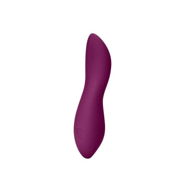 The Dame Dip 2.0 - Basic Vibrator by Dame is a purple, ergonomically shaped device crafted from medical-grade silicone, showcasing a smooth and curved design set against a plain white background.
