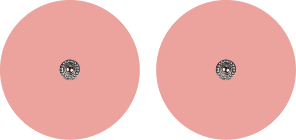 Two blush pink circular electrode replacement pads for the Tap 2.0 – designed to pair with the Tap 2.0 electrode cord for spot placement