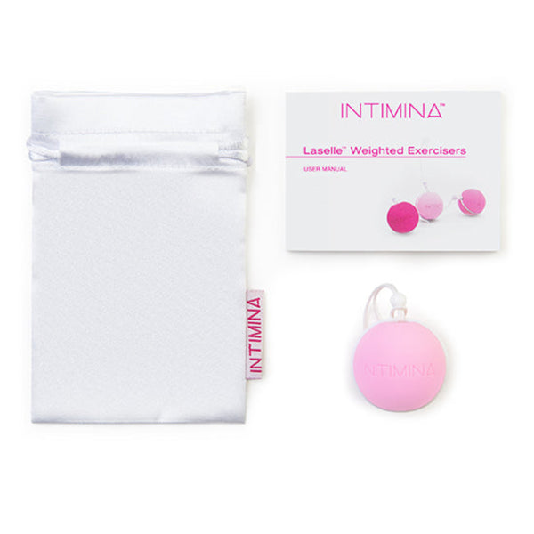 A white drawstring pouch, an Intimina Laselle Kegel Exercisers user manual, and a round pink case—ideal for pelvic floor muscle training—are neatly displayed on a white background.