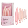 The Inspire Silicone Dilator Kit by CalExotics includes five pink dilators with loop handles, presented alongside a semi-transparent box that emphasizes benefits for vaginal wellness, strength, and comfort.