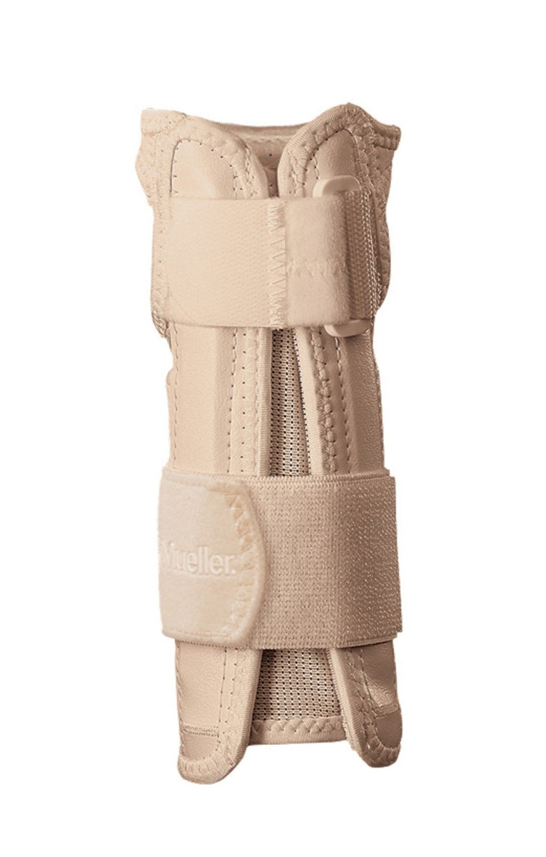 The Mueller Carpal Tunnel Wrist Brace is a beige support featuring multiple adjustable straps and a central mesh panel, designed to offer stability and relief for wrist injuries. The brand name "Mueller" is prominently displayed on one of the straps, ensuring effective pain relief and support.