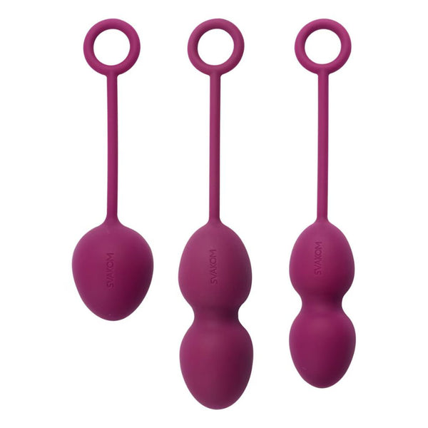 Three Intimina Laselle Kegel Exercisers in purple silicone, each with a retrieval loop, are shown upright: a single weighted ball on the left, double balls in the middle, and double contoured balls on the right to strengthen pelvic floor muscles.