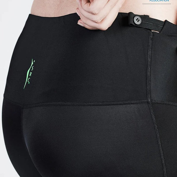 Close-up of a person wearing black SRC Maternity Leggings from SRC Health, featuring an adjustable waistband and offering Varicose Vein Relief. The SRC logo is visible on the waist, and the Australian Physiotherapy Association endorsement logo appears in the top right corner.