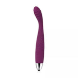 The Svakom Cici – Slim Flexible G-Spot Vibrator by Svakom is a purple silicone vibrator with a curved, textured tip and a silver base, shown with water droplets on its surface against a plain white background.
