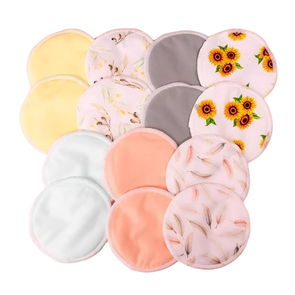 Bubba Bump's Organic Bamboo Reusable Breast Pads - 14 Pack features a collection of ultra-absorbent, round pads made from organic bamboo. Displayed in an array of colors and patterns—solid pastels, floral prints, and designs with feathers and sunflowers—they are neatly arranged on a white background.