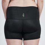 A person wearing a black SRC Maternity Shorts Mini from SRC Health and a matching black sports bra, with a small green logo on the back. The image is taken from behind, showcasing the back of the athletic wear designed for excellent support and comfort.