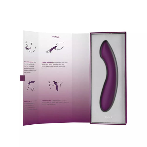 The Svakom Amy 2 is a purple, curved G-spot vibrator made from body-safe silicone, packaged in a box with illustrated instructions. Designed for internal and external stimulation, this strong and flexible vibrator is by Svakom.