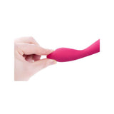 A hand bends the flexible, pink silicone shaft of the Svakom Iris Slim Semi-Flexible G-Spot Vibrator against a white background—ideal for those seeking targeted pelvic pain relief.