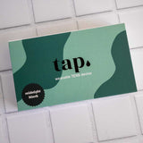 A rectangular box on a tiled surface labeled 
