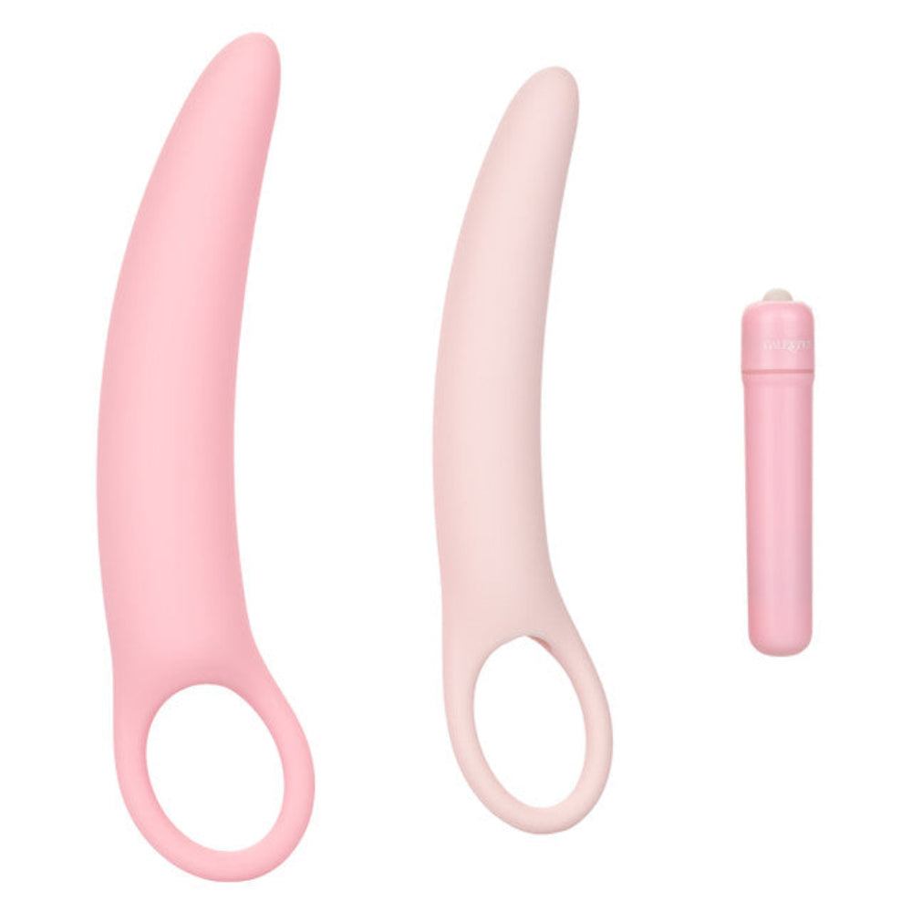The Calexotics Inspire Vibrating Vaginal Dilator Kit 3-Piece Set features two pink silicone dilators with ring-shaped handles and a matching bullet vibrator, perfect for pelvic floor therapy and comfort.