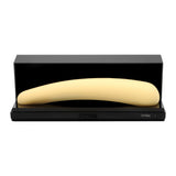 The Iroha Mikazuki – a gentle, slim, pale yellow vibrator for beginners – is shown in an open black rectangular case featuring the Iroha brand name on the front.