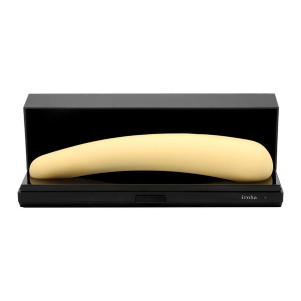 The Iroha Mikazuki – a gentle, slim, pale yellow vibrator for beginners – is shown in an open black rectangular case featuring the Iroha brand name on the front.