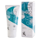 A 100ml tube of YES® WB Water-Based Lubricant by YES® is positioned beside its box packaging. The tube and box feature a white and teal design with product information and logos indicating it is pH balanced, certified organic, and provides long-lasting hydration.